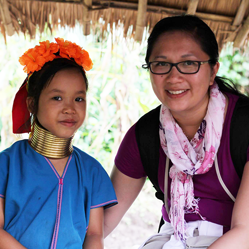 Yexus Fest volunteer serving a local child